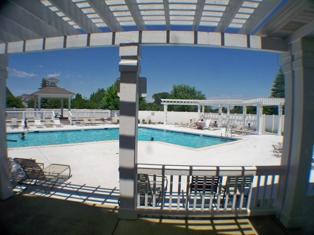 3016 Falling Waters Lane, Unit 3016 Lindenhurst, IL 60046 - Photo 16 of 21 a view of a chairs and table in the balcony