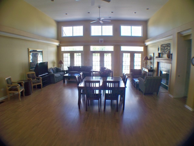3016 Falling Waters Lane, Unit 3016 Lindenhurst, IL 60046 - Photo 17 of 21 a view of a dining room with furniture window and wooden floor
