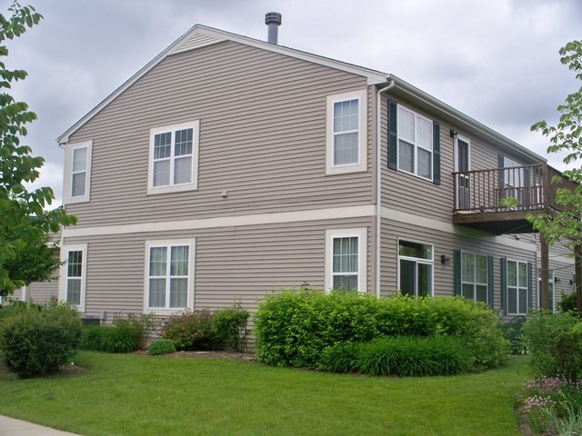 3016 Falling Waters Lane, Unit 3016 Lindenhurst, IL 60046 - Photo 4 of 21 a front view of a house with a yard