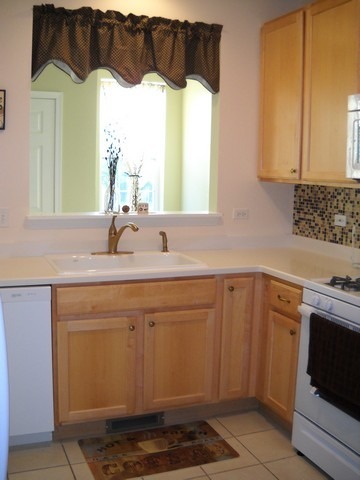 3016 Falling Waters Lane, Unit 3016 Lindenhurst, IL 60046 - Photo 6 of 21 a bathroom with a sink and a mirror