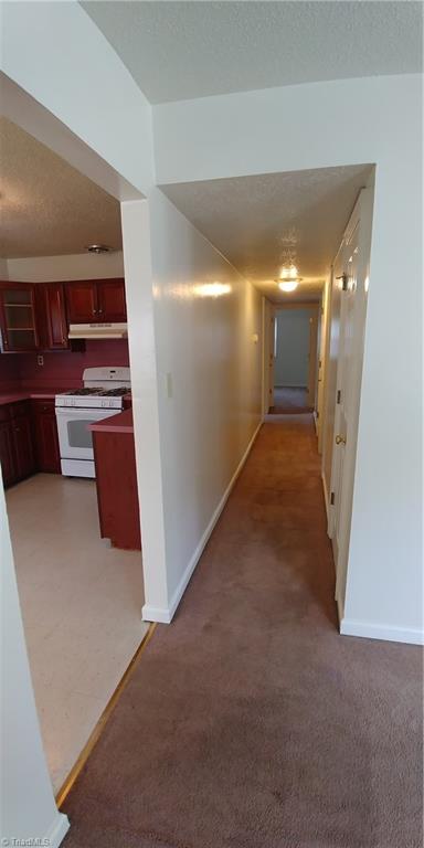606 Habersham Road High Point, NC 27260 - Photo 14 of 17 Long hallway leads to 5 bedrooms and 2 full bathrooms.