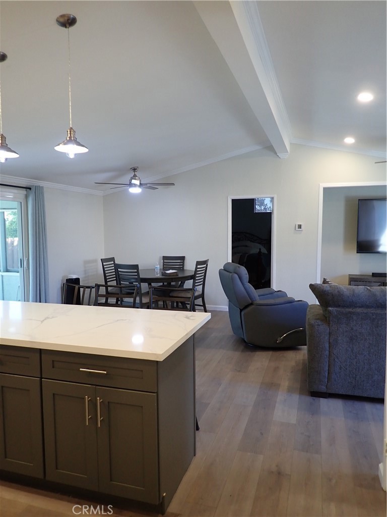 27250 Murrieta Road, Unit 386 Menifee, CA 92586 - Photo 18 of 32 a large white kitchen with a large island