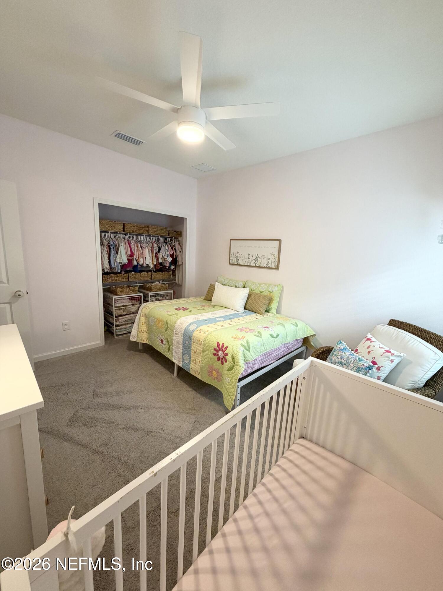 75457 Banyan Way Yulee, FL 32097 - Photo 12 of 36 a bedroom with two beds and a window