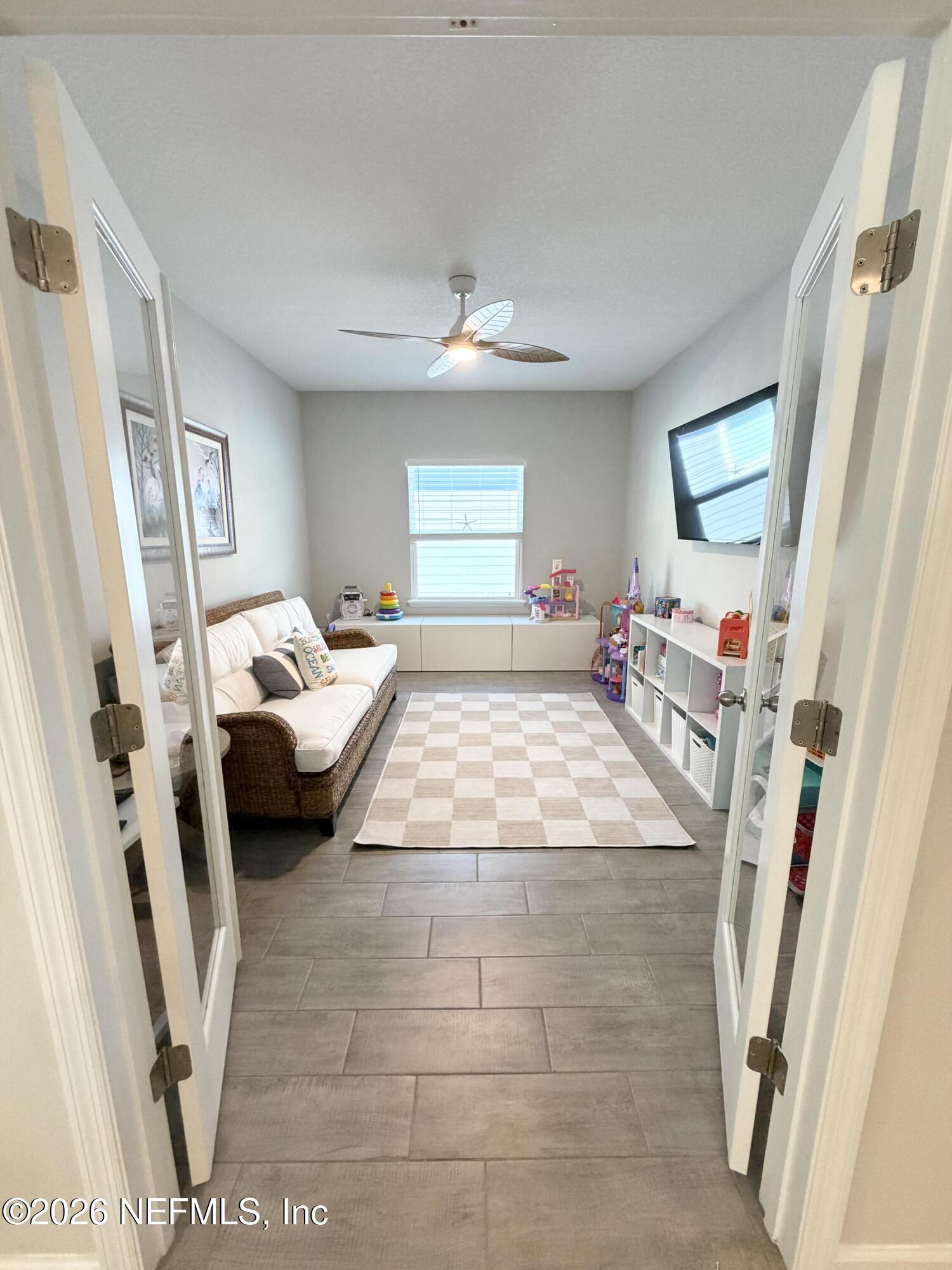 75457 Banyan Way Yulee, FL 32097 - Photo 16 of 36 a bedroom with furniture and a window