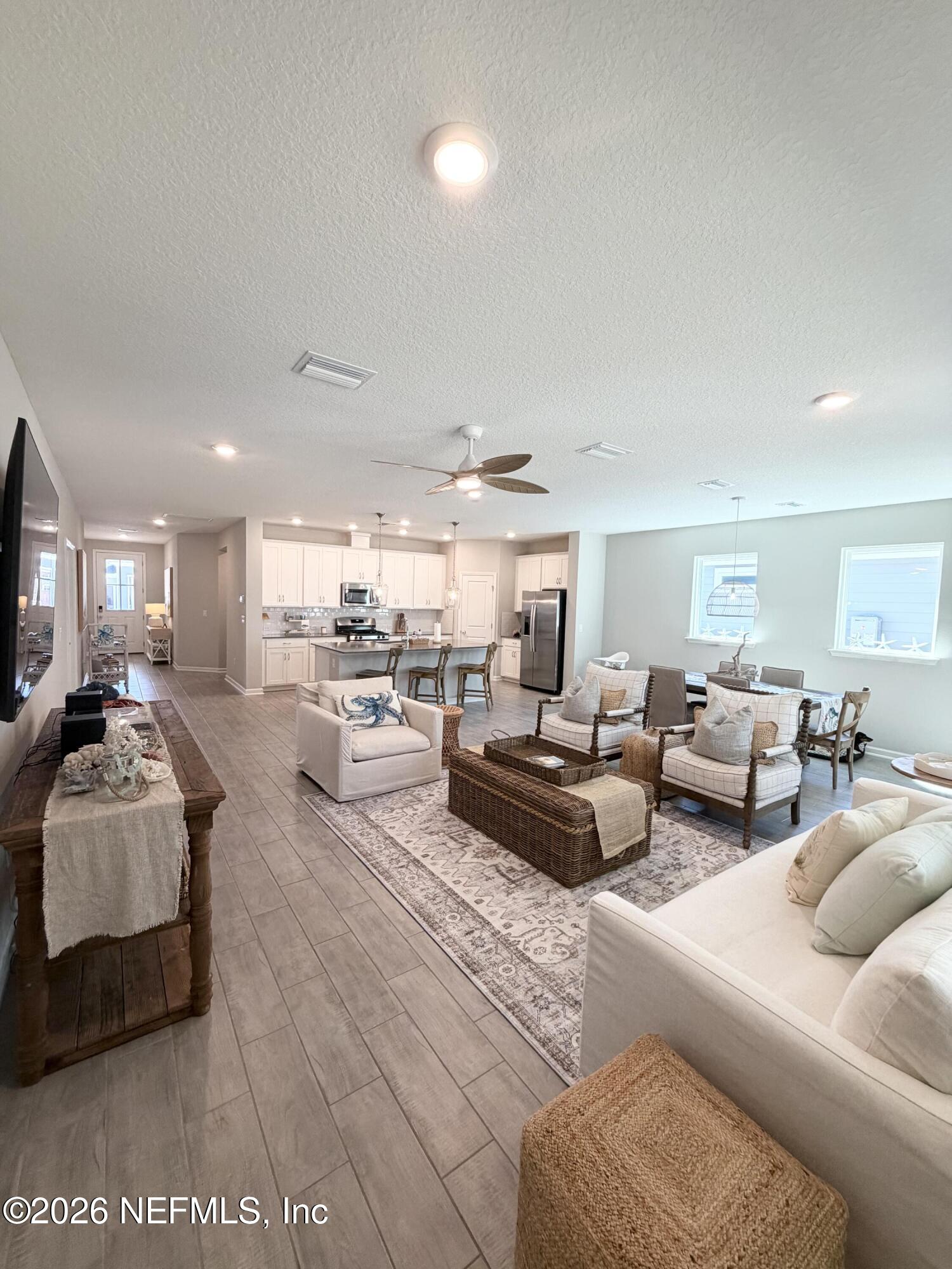75457 Banyan Way Yulee, FL 32097 - Photo 20 of 36 a living room with furniture and a view of kitchen