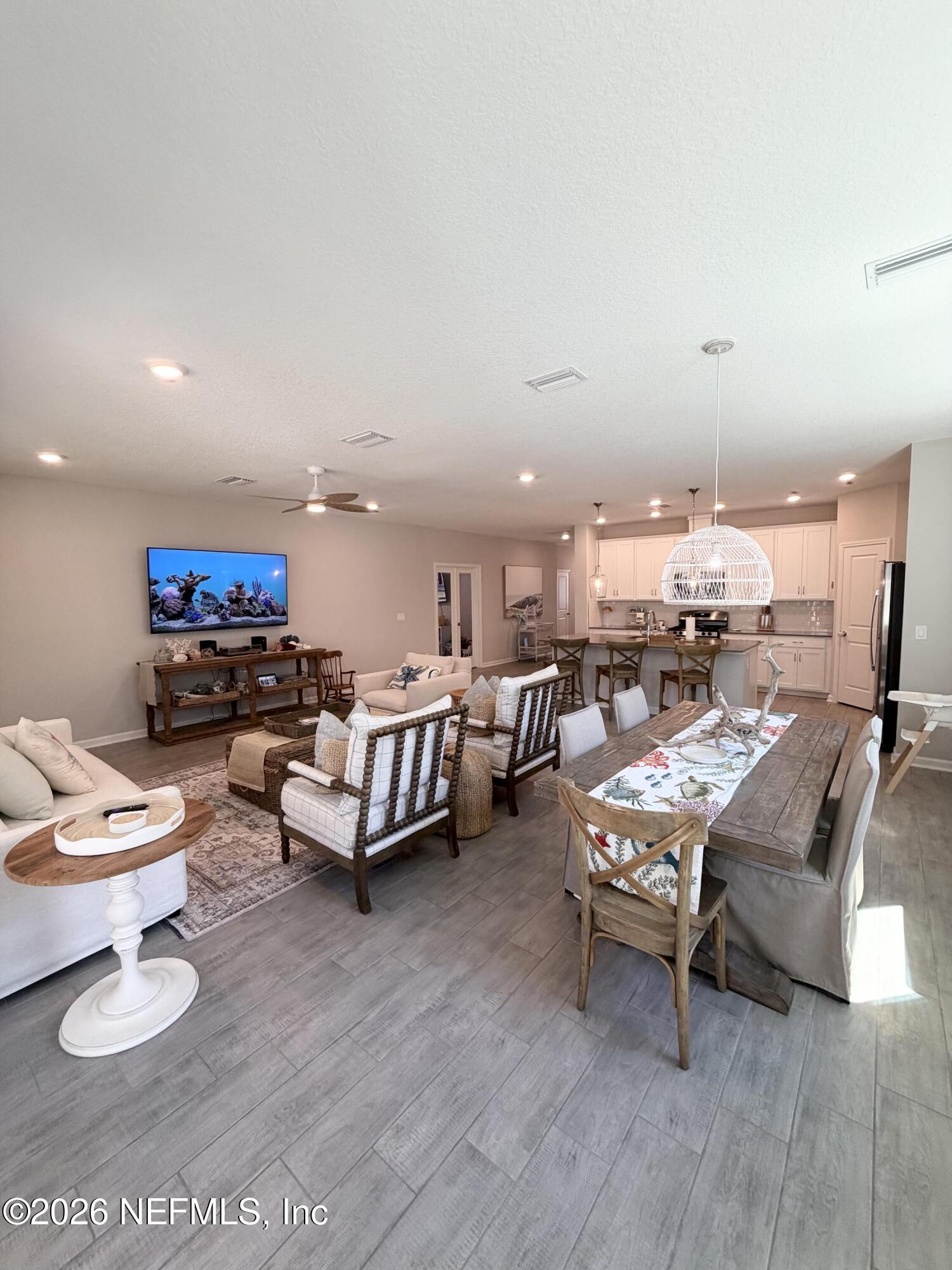 75457 Banyan Way Yulee, FL 32097 - Photo 21 of 36 a living room with furniture and a wooden floor