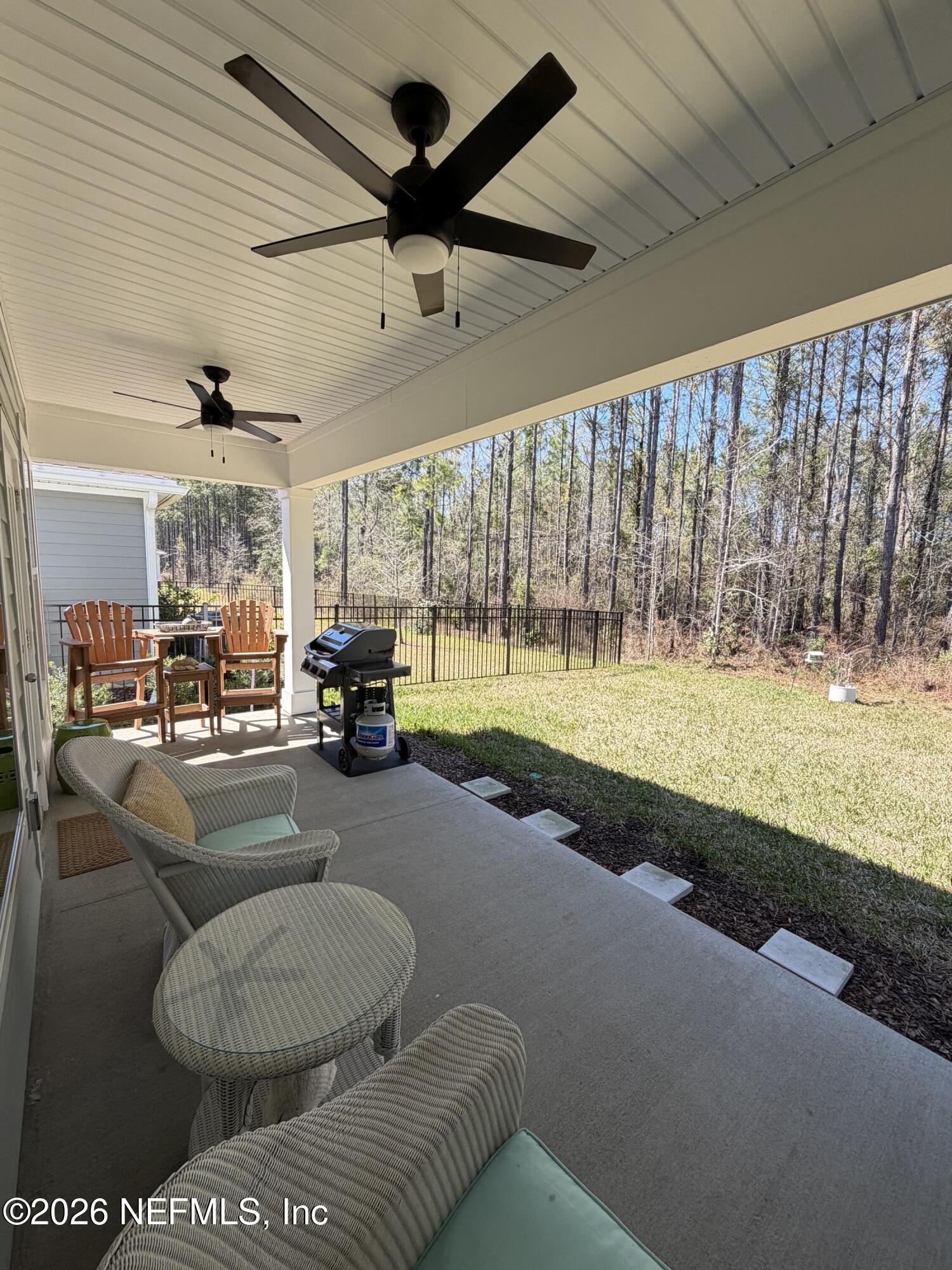 75457 Banyan Way Yulee, FL 32097 - Photo 30 of 36 a living room with furniture and a large window