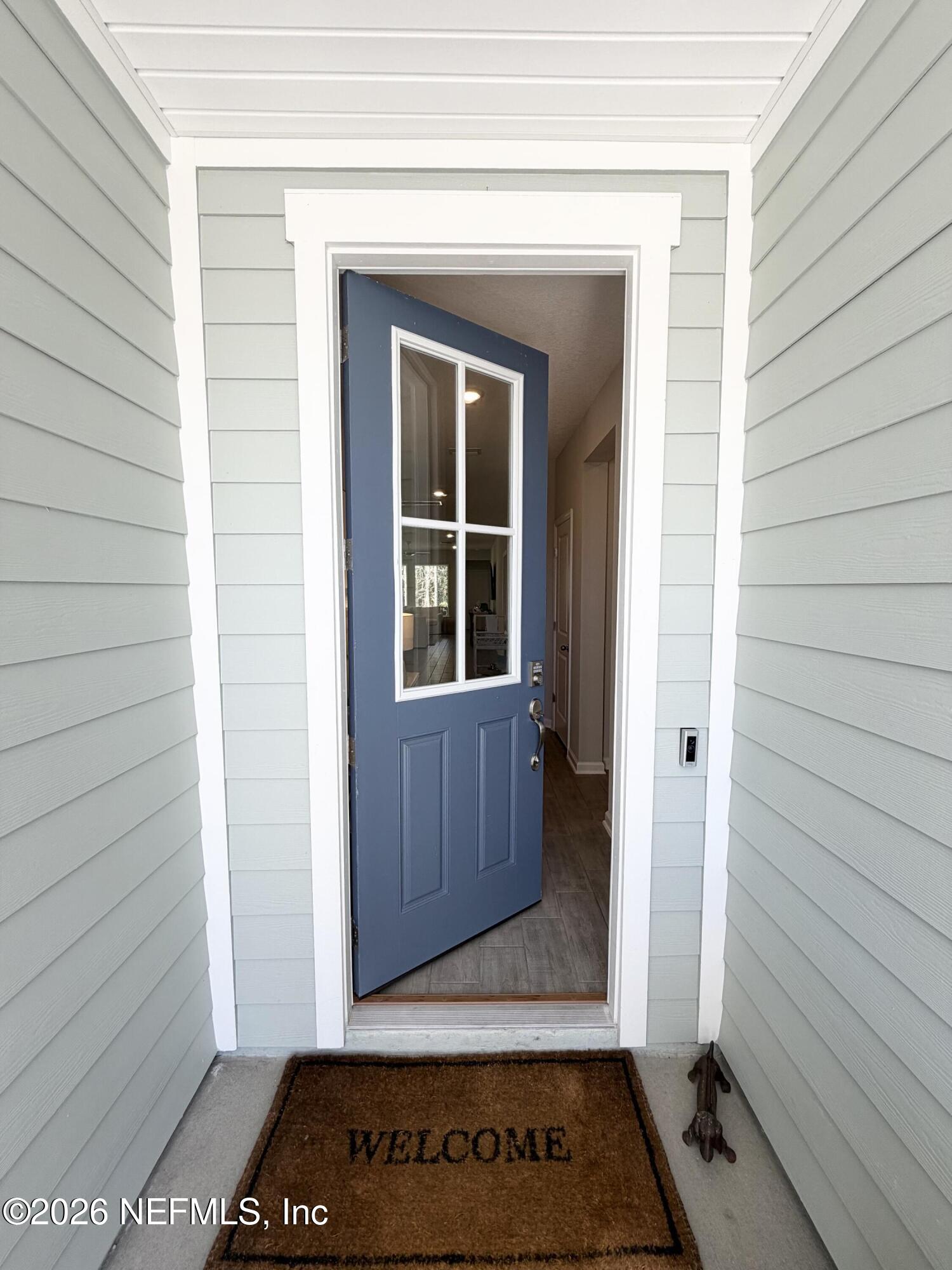 75457 Banyan Way Yulee, FL 32097 - Photo 4 of 36 a view of front door with wooden floor