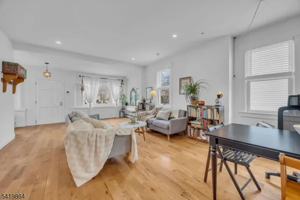 a living room with furniture and a table