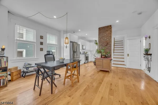 a view of a livingroom with furniture and a wooden floor
