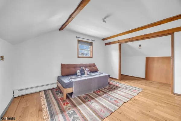 a living room with a couch and a rug