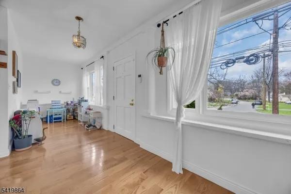 a view of a livingroom with furniture and a window