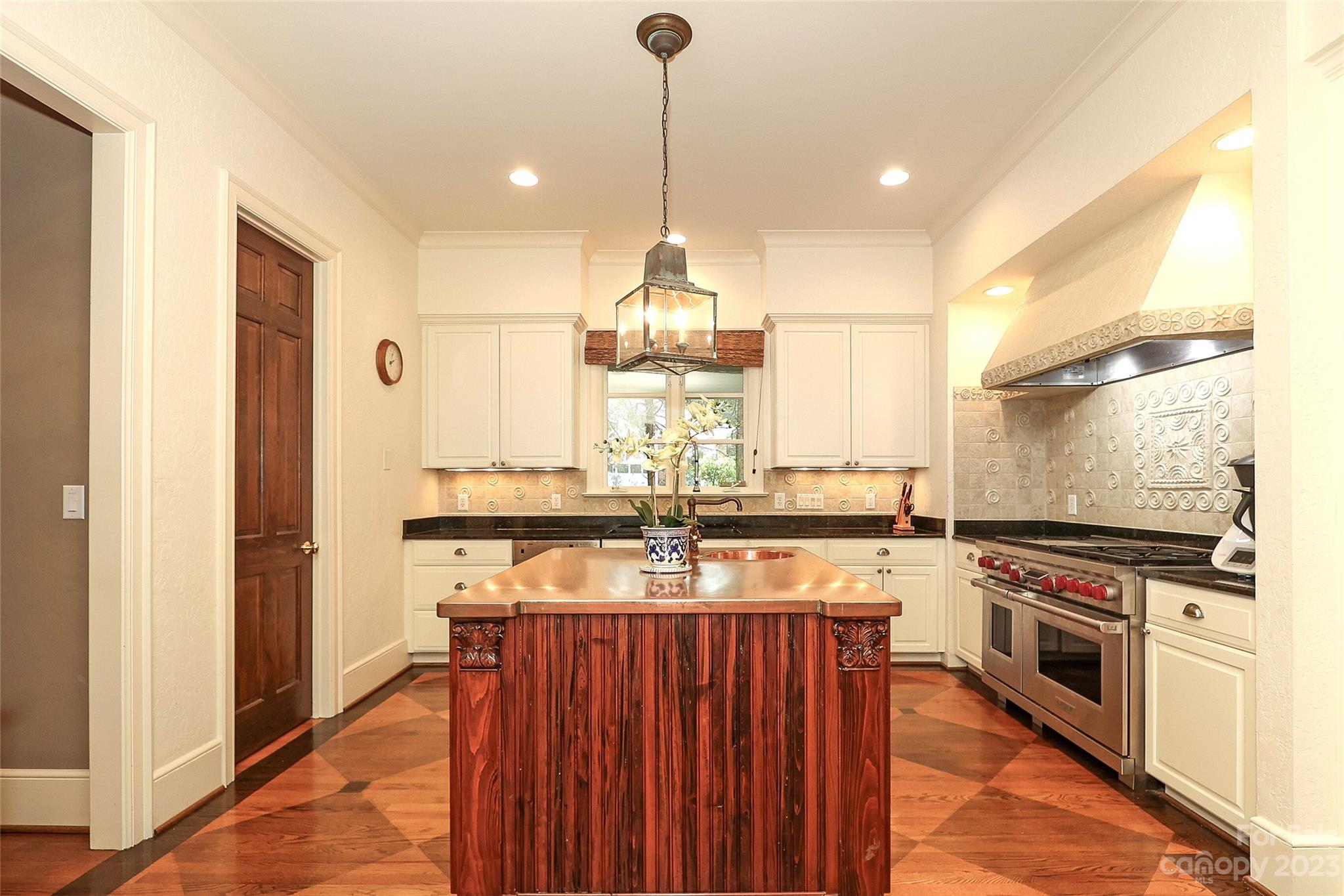 2416 Warburton Road Charlotte, NC 28211 - Photo 16 of 46 a kitchen with stainless steel appliances granite countertop a stove and a refrigerator
