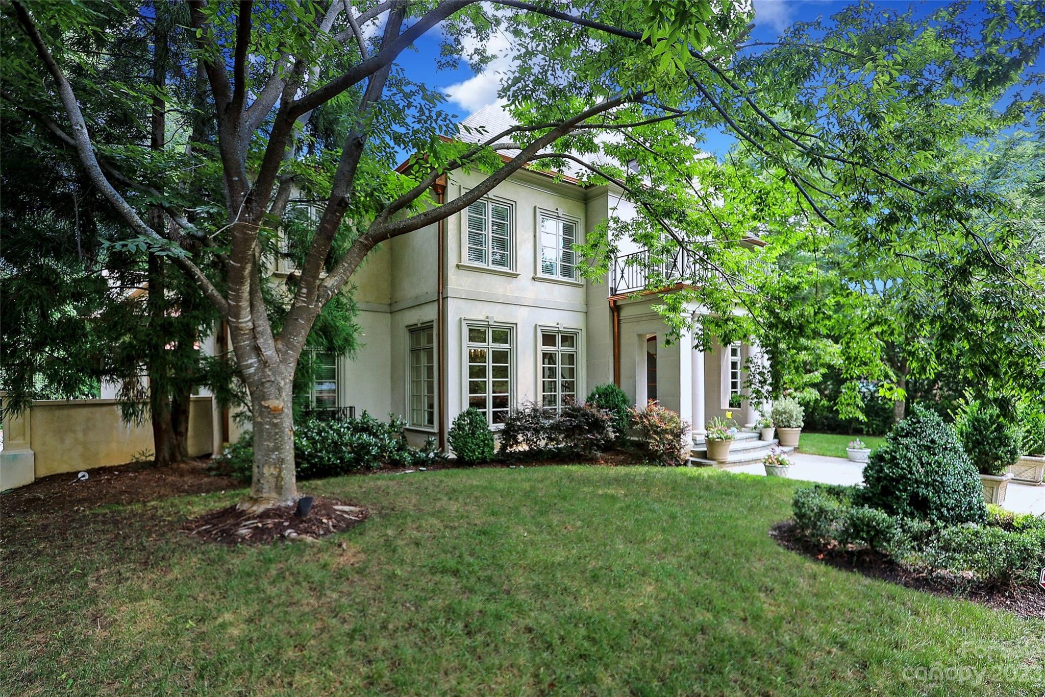 2416 Warburton Road Charlotte, NC 28211 - Photo 2 of 46 a front view of a house with a garden