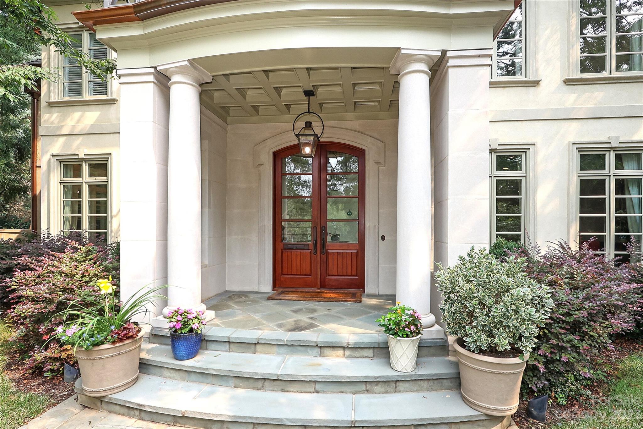 2416 Warburton Road Charlotte, NC 28211 - Photo 3 of 46 a view of a entryway door of the house with potted plants