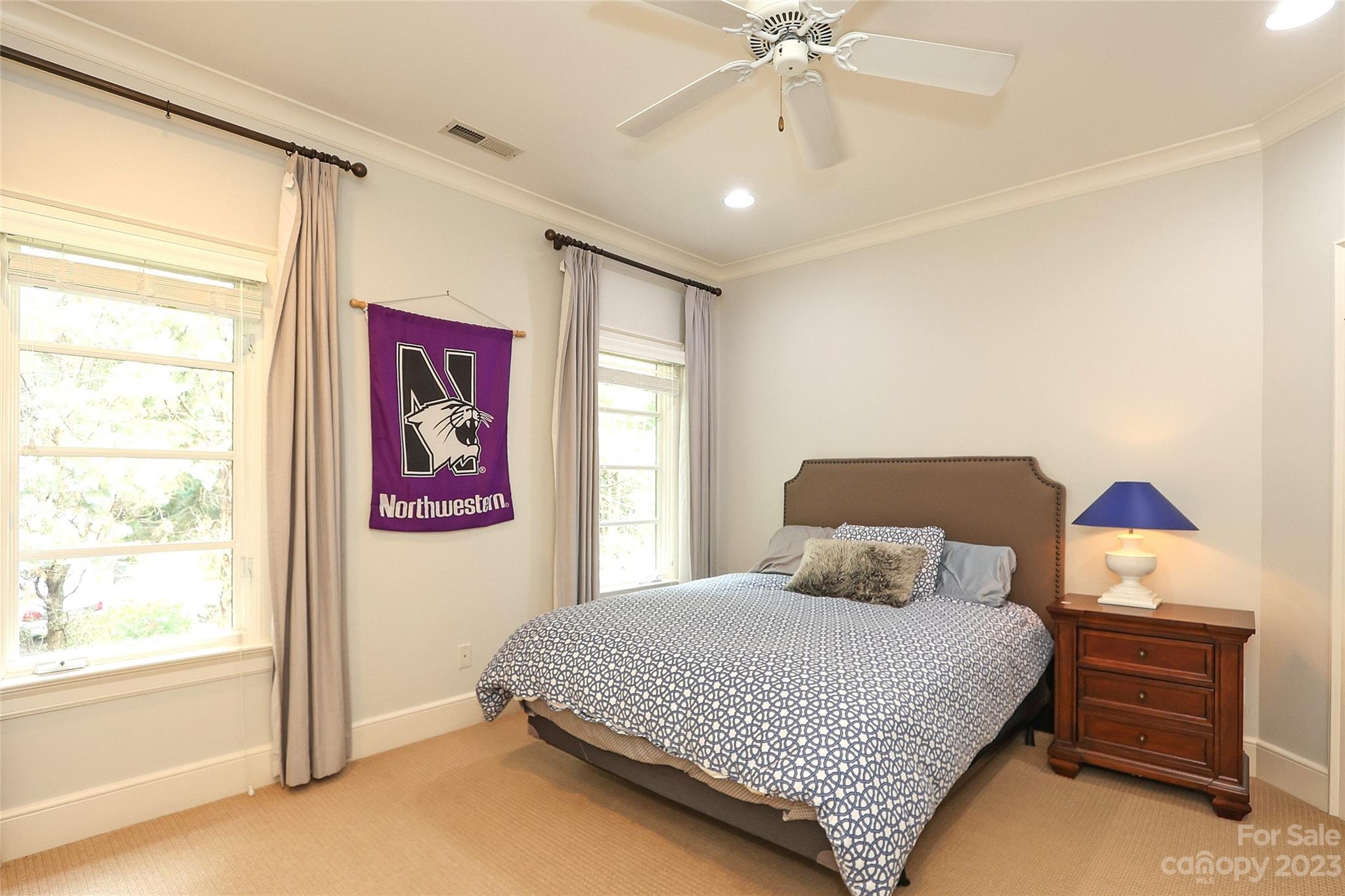 2416 Warburton Road Charlotte, NC 28211 - Photo 31 of 46 a bedroom with a bed and a window