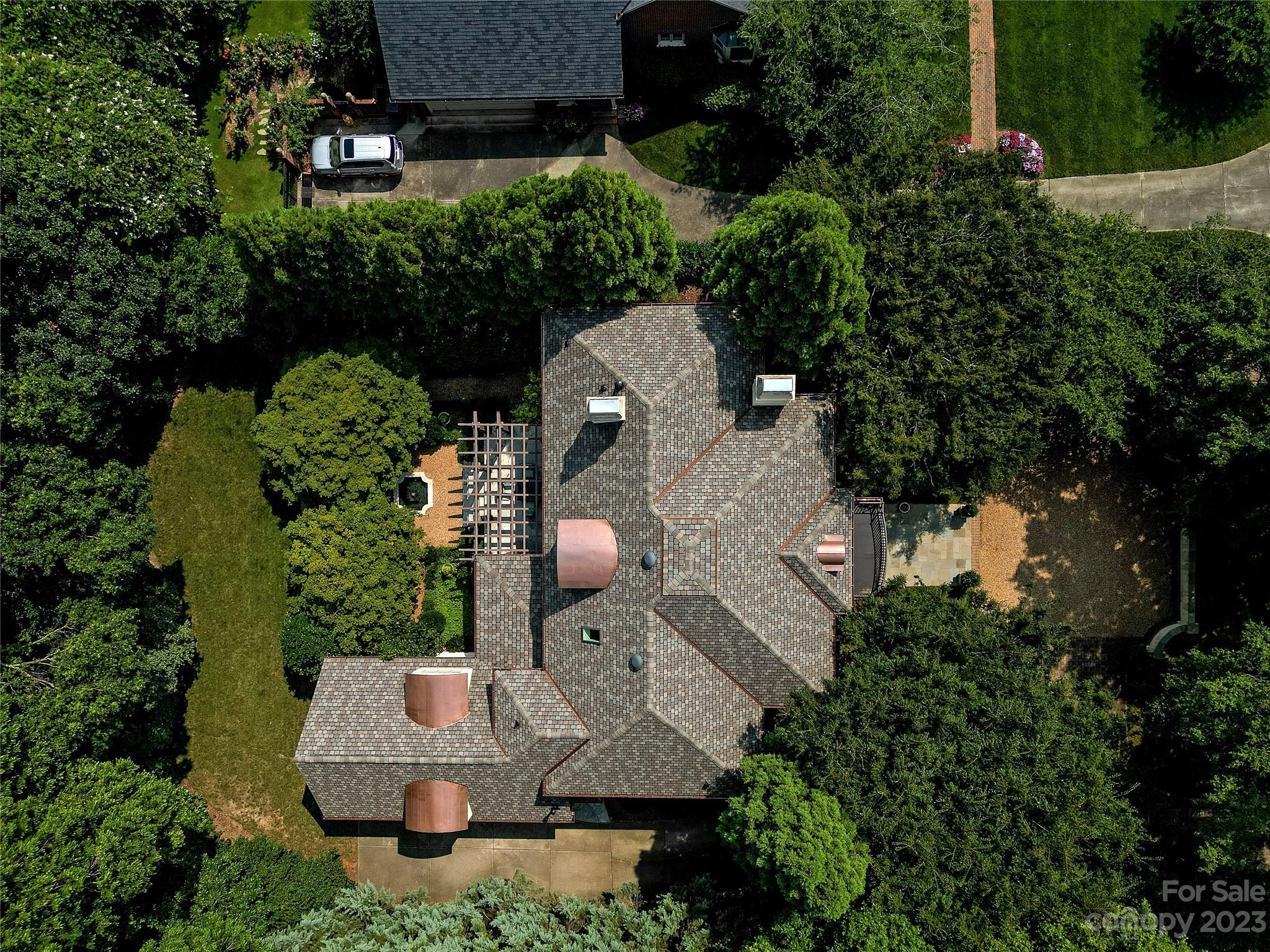 2416 Warburton Road Charlotte, NC 28211 - Photo 45 of 46 an aerial view of a house with a yard and large trees