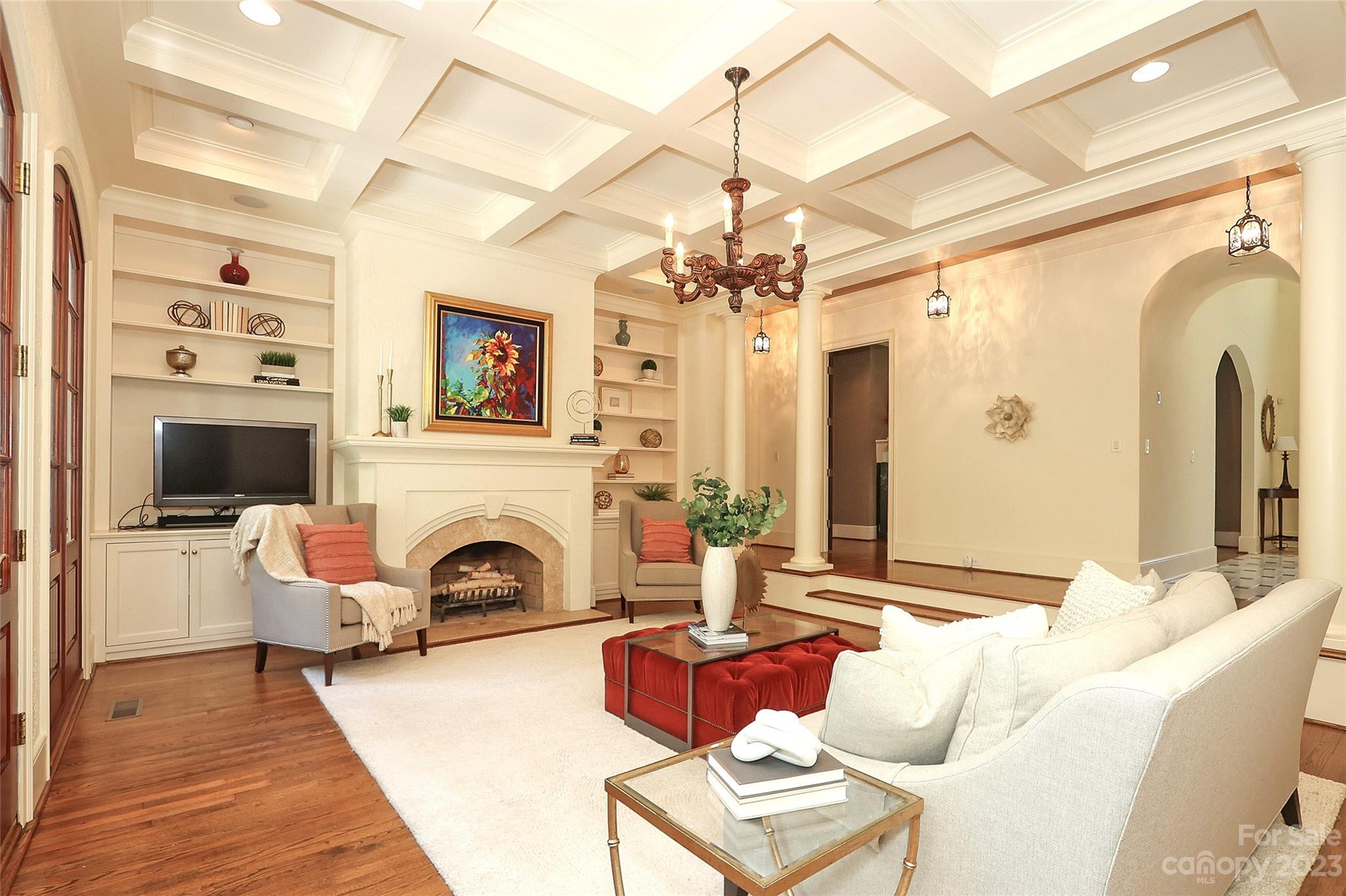 2416 Warburton Road Charlotte, NC 28211 - Photo 10 of 46 a living room with furniture a fireplace and a chandelier