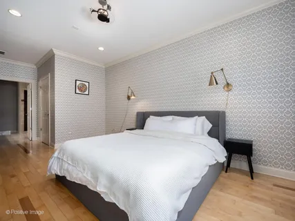 a bedroom with a bed and a table
