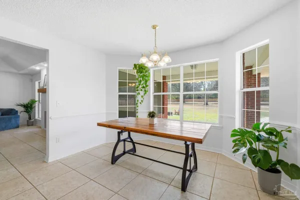 a reading room with furniture and a window