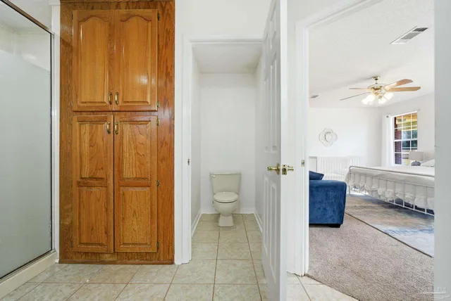 a view of a hallway with closet and front door