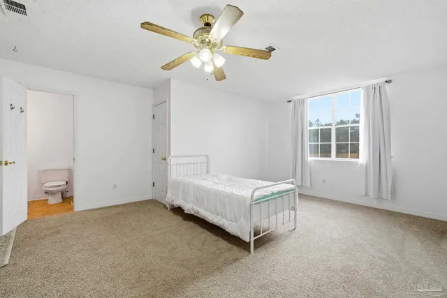 a room with a bed and window