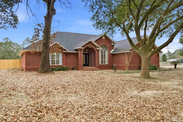 front view of a house with a trees