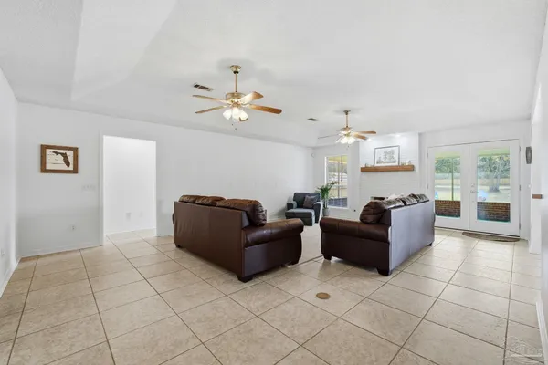 a living room with furniture and a window