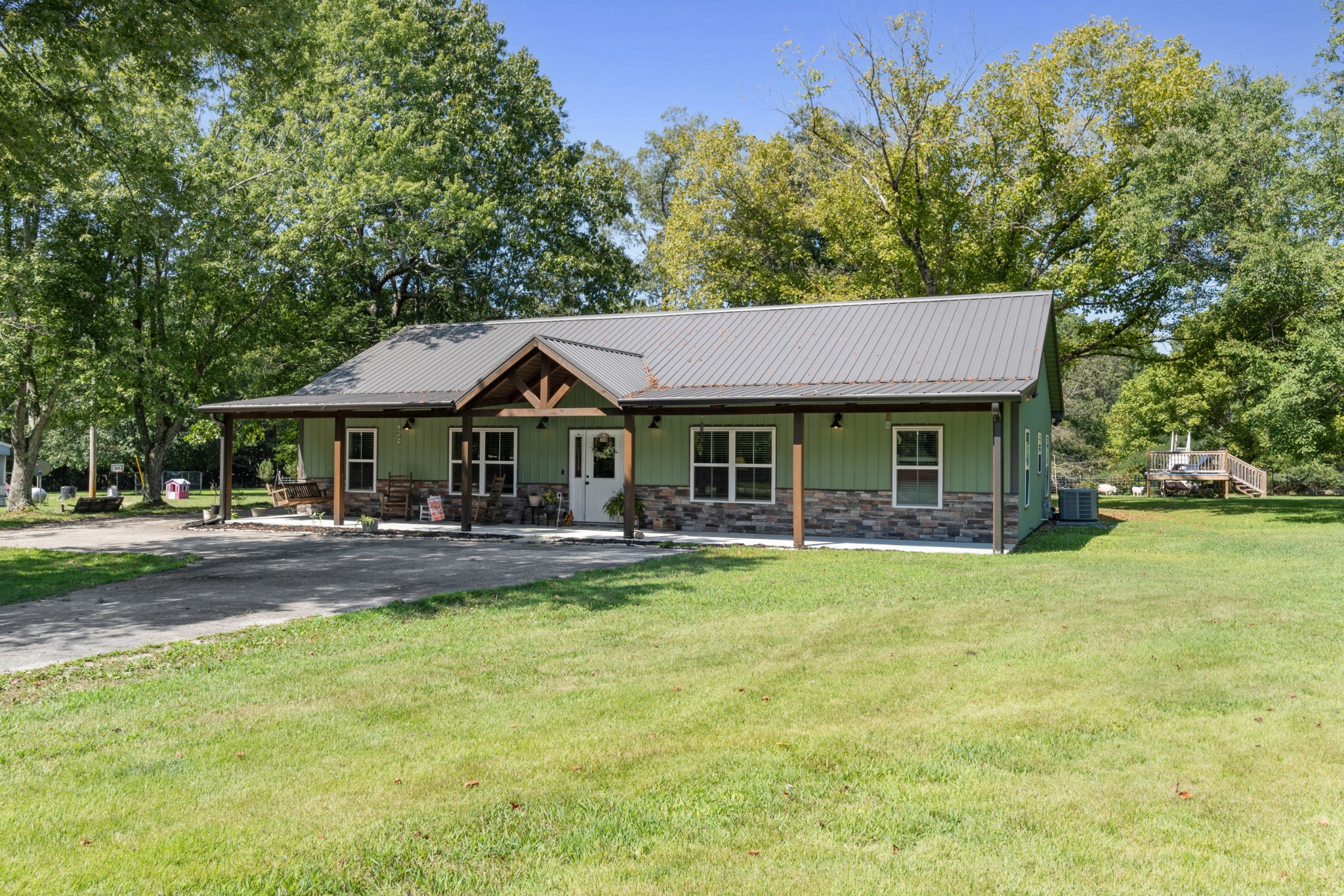 a front view of house with yard and outdoor seating