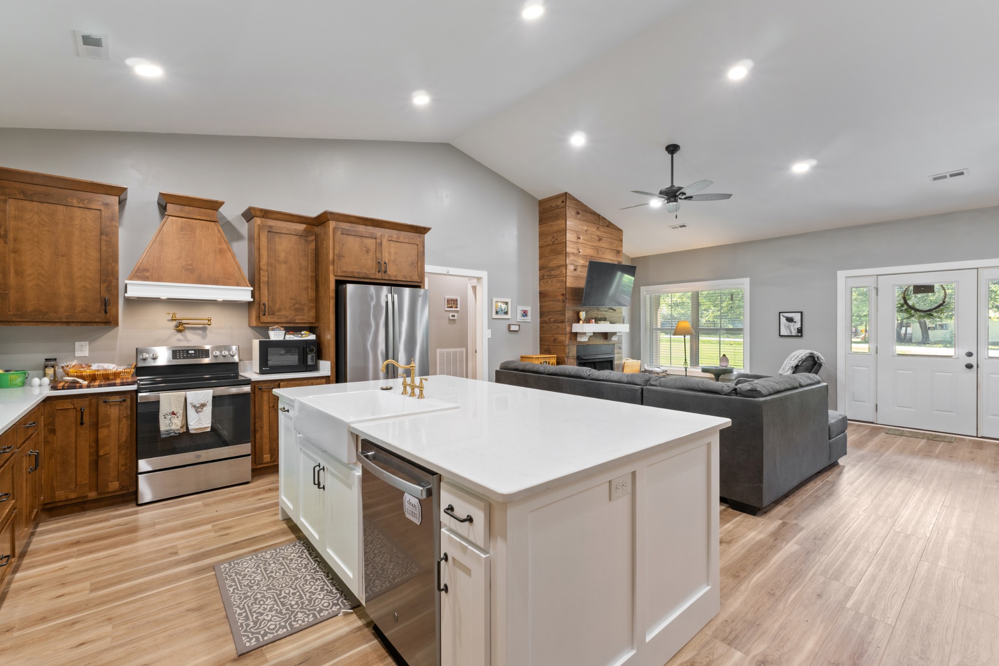 232 Clyde Vickers Road Estill Springs, TN 37330 - Photo 11 of 25 a kitchen with a stove a sink a refrigerator and cabinets