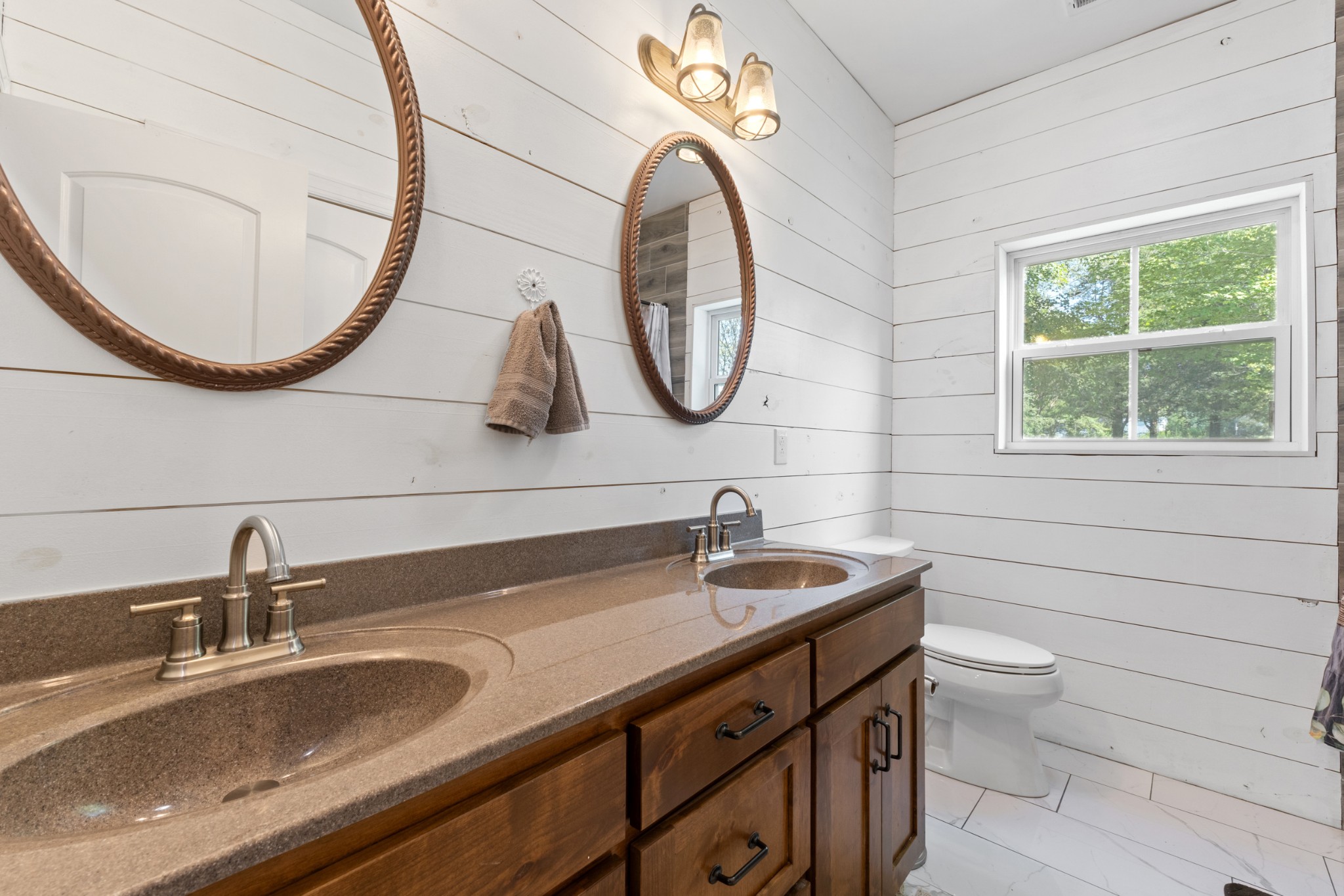 232 Clyde Vickers Road Estill Springs, TN 37330 - Photo 19 of 25 a bathroom with a sink and a mirror