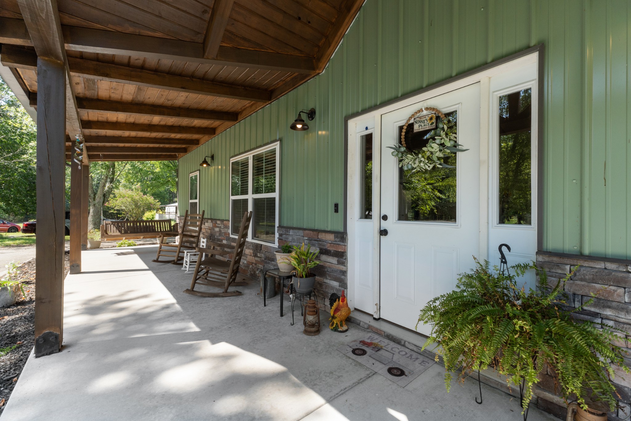232 Clyde Vickers Road Estill Springs, TN 37330 - Photo 3 of 25 a living room with patio furniture and potted plants