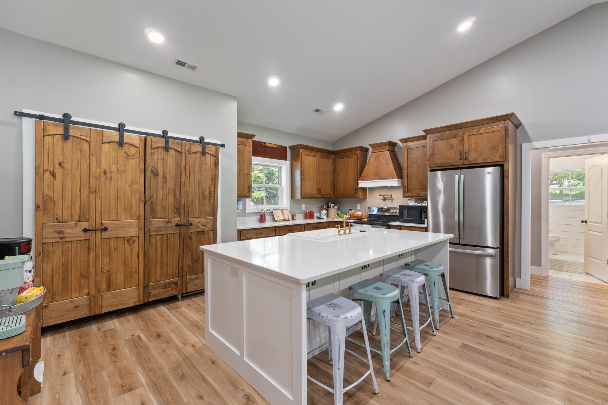 232 Clyde Vickers Road Estill Springs, TN 37330 - Photo 6 of 25 a kitchen with kitchen island a large counter top space and stainless steel appliances