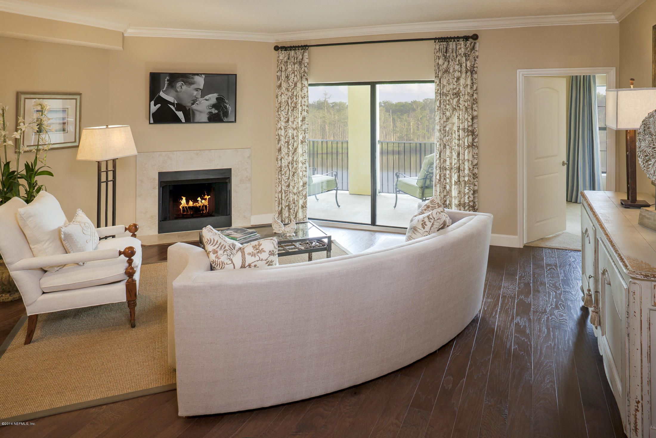 3958 Baymeadows Road, Unit 2202 Jacksonville, FL 32217 - Photo 2 of 9 a living room with furniture and a fireplace