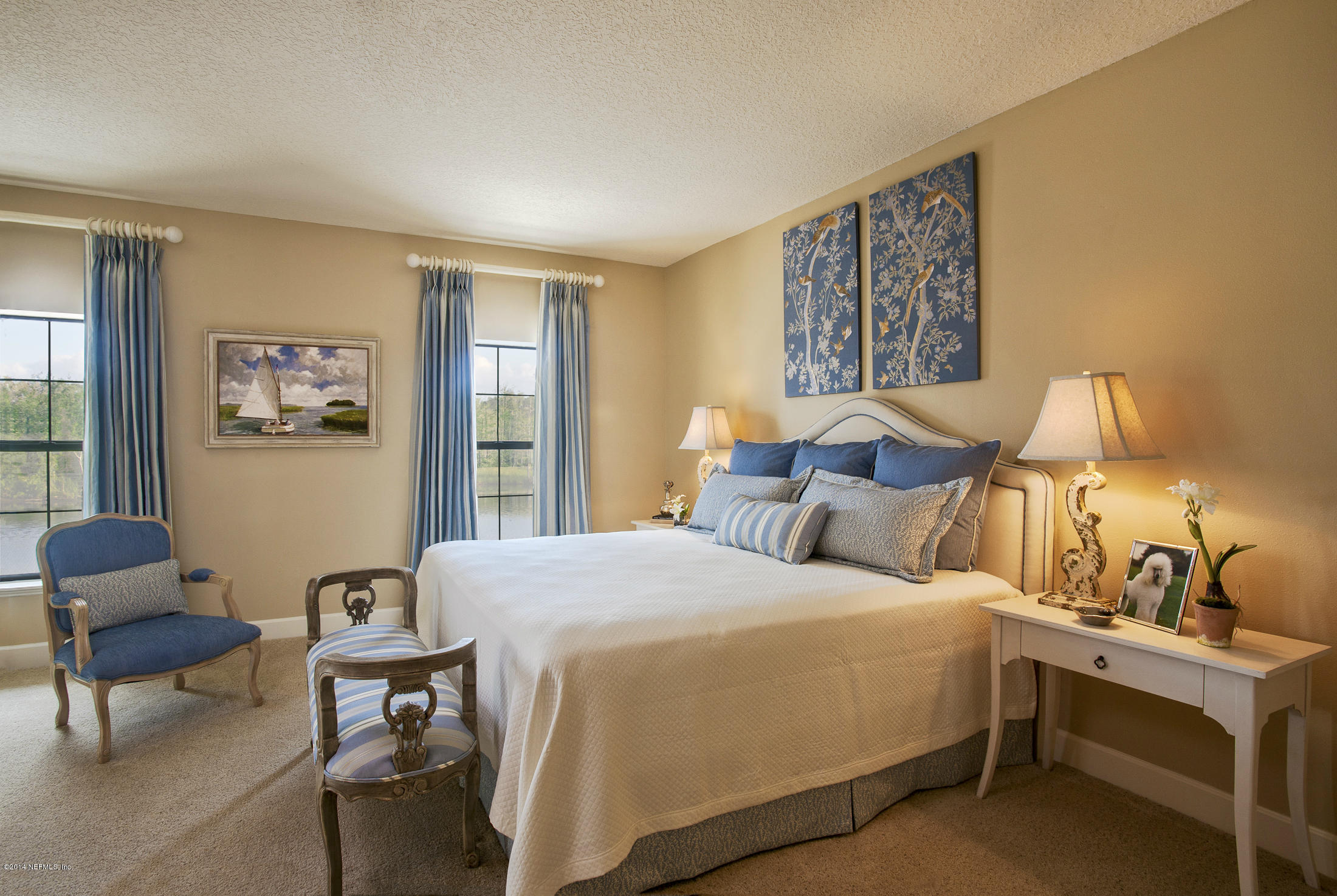 3958 Baymeadows Road, Unit 2202 Jacksonville, FL 32217 - Photo 7 of 9 a bedroom with a bed and a couch