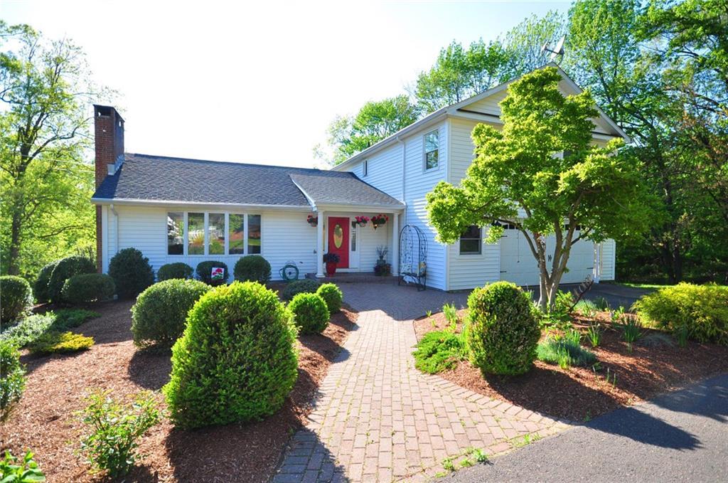 895 Newgate Road Suffield, CT 06093 - Photo 1 of 1 a front view of a house with garden