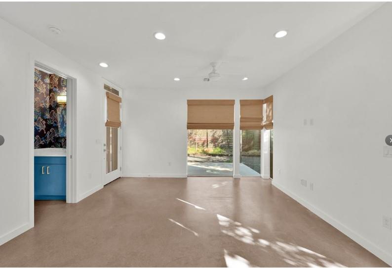 203 East 46th Street Austin, TX 78751 - Photo 6 of 13 Empty room featuring finished concrete floors, a ceiling fan, and recessed lighting