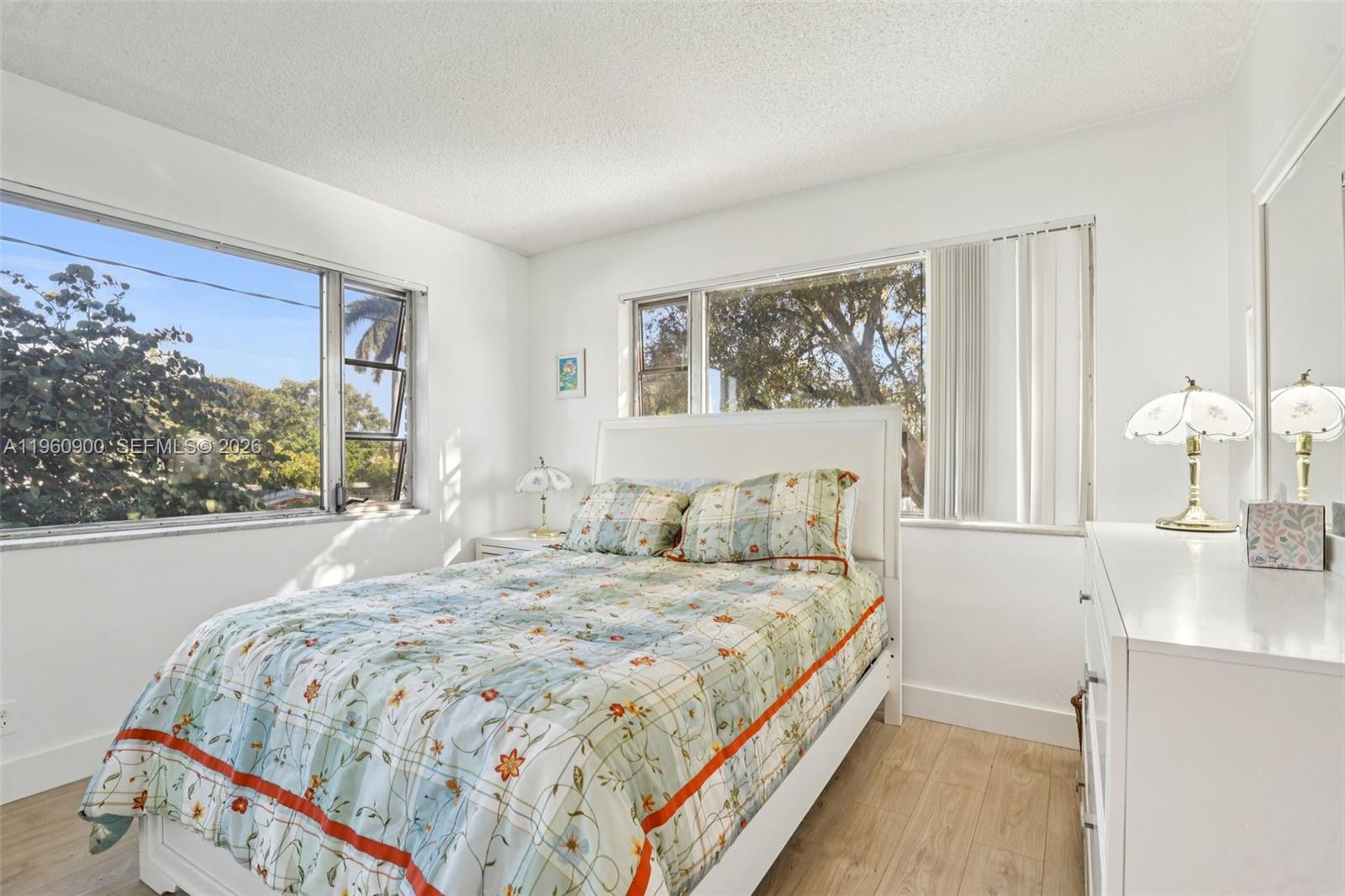 310 South Cypress Road, Unit 730 Pompano Beach, FL 33060 - Photo 15 of 26 a bedroom with a large bed and a window