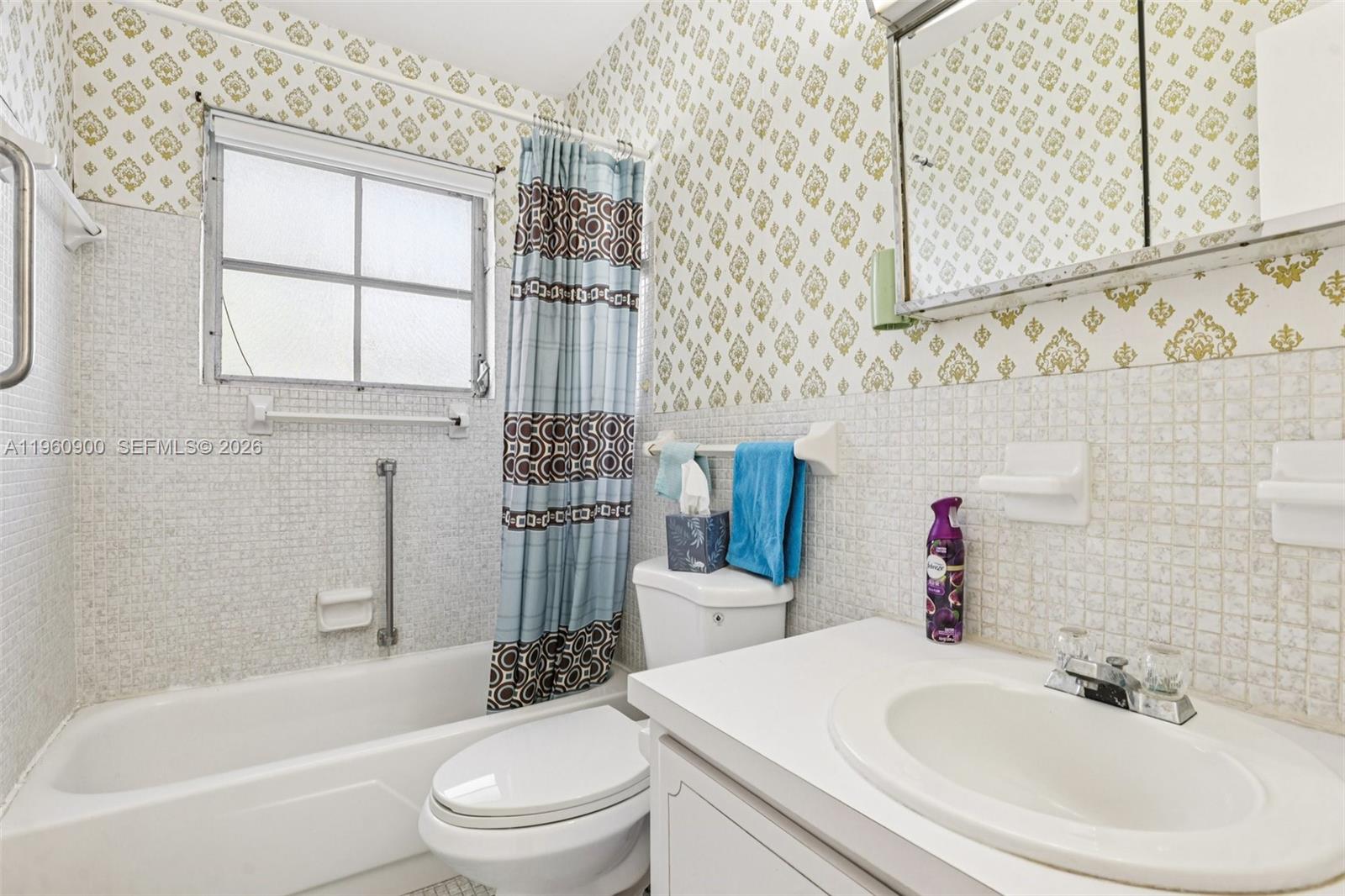 310 South Cypress Road, Unit 730 Pompano Beach, FL 33060 - Photo 23 of 26 a bathroom with a sink toilet and shower