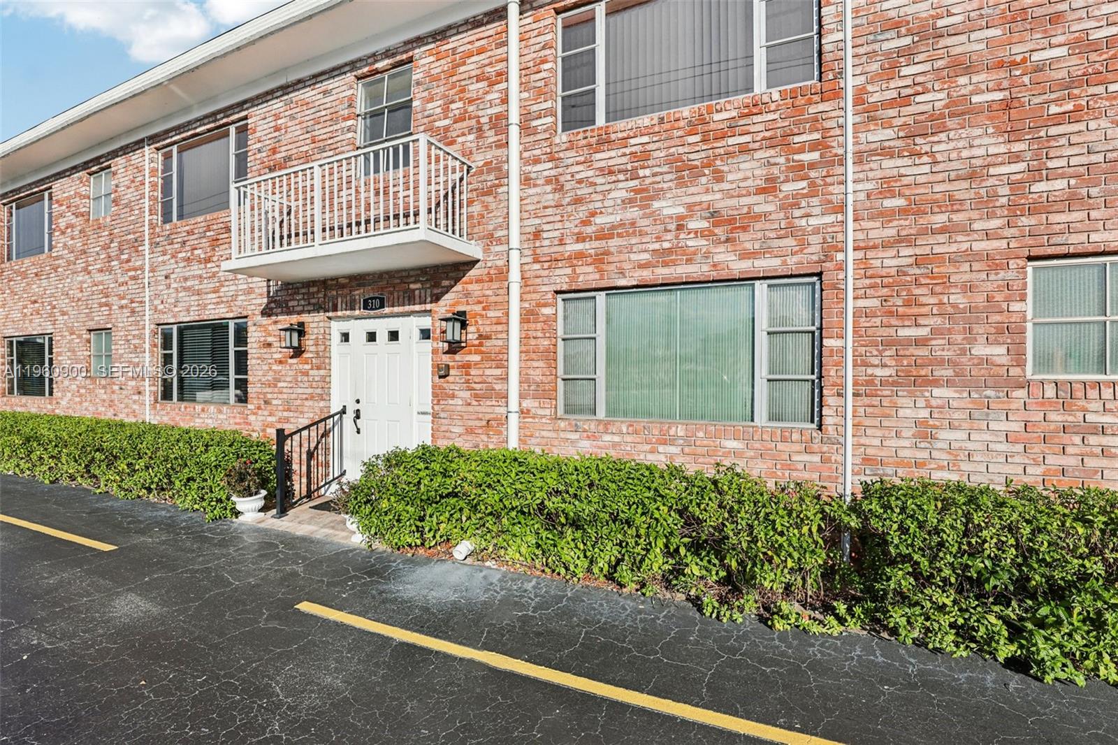 310 South Cypress Road, Unit 730 Pompano Beach, FL 33060 - Photo 3 of 26 a view of a brick house with a large windows