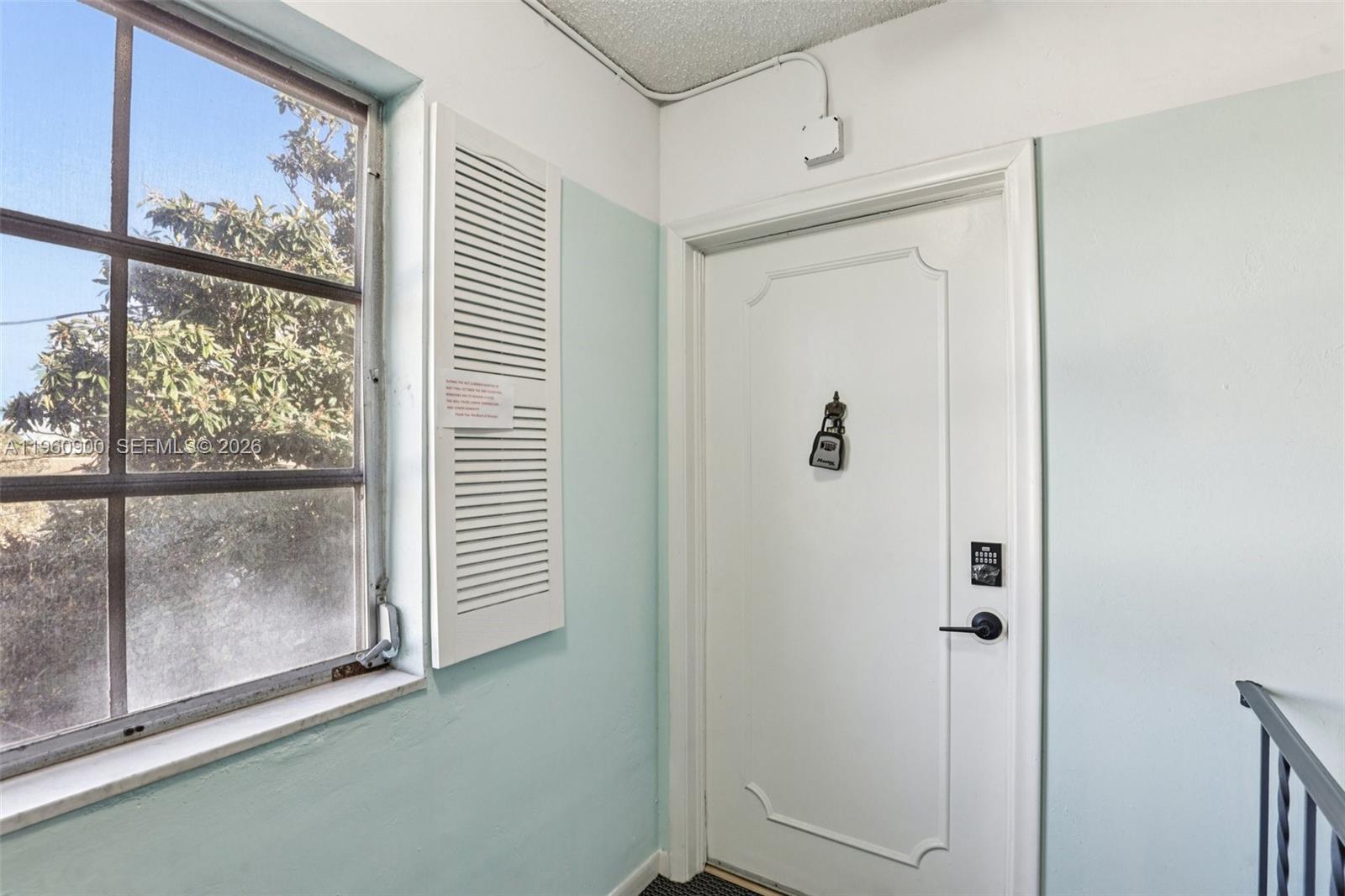 310 South Cypress Road, Unit 730 Pompano Beach, FL 33060 - Photo 4 of 26 a bathroom with a glass shower door