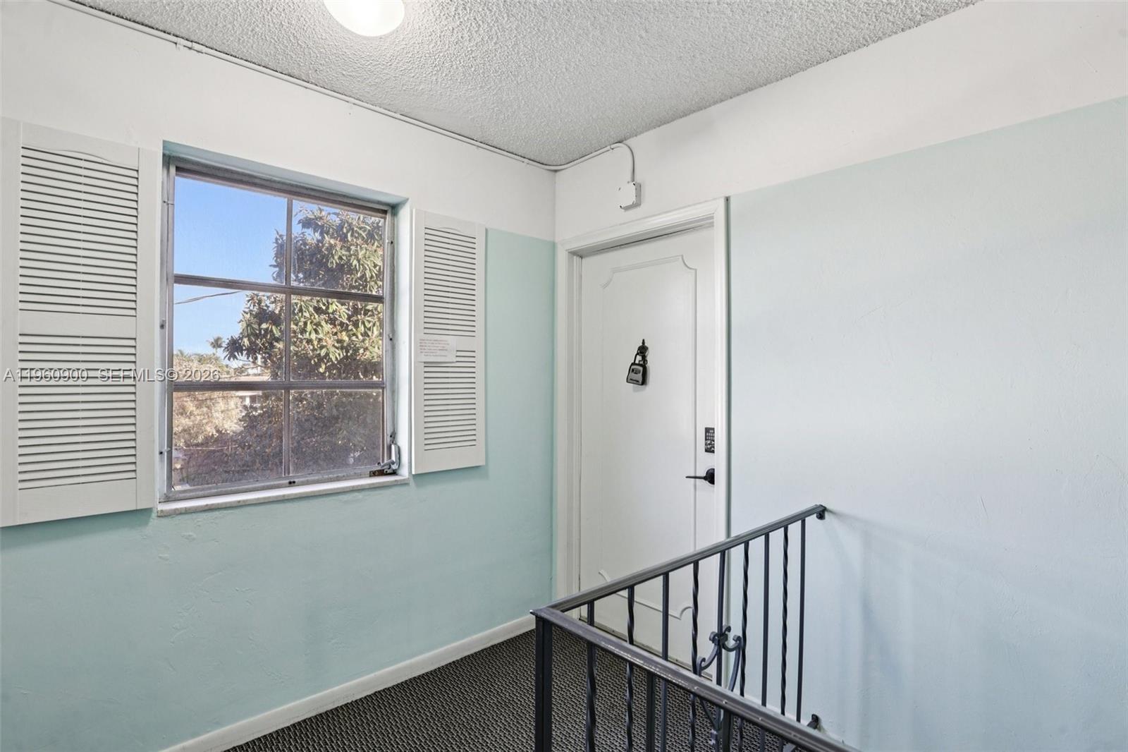 310 South Cypress Road, Unit 730 Pompano Beach, FL 33060 - Photo 5 of 26 a view of a hallway with a window