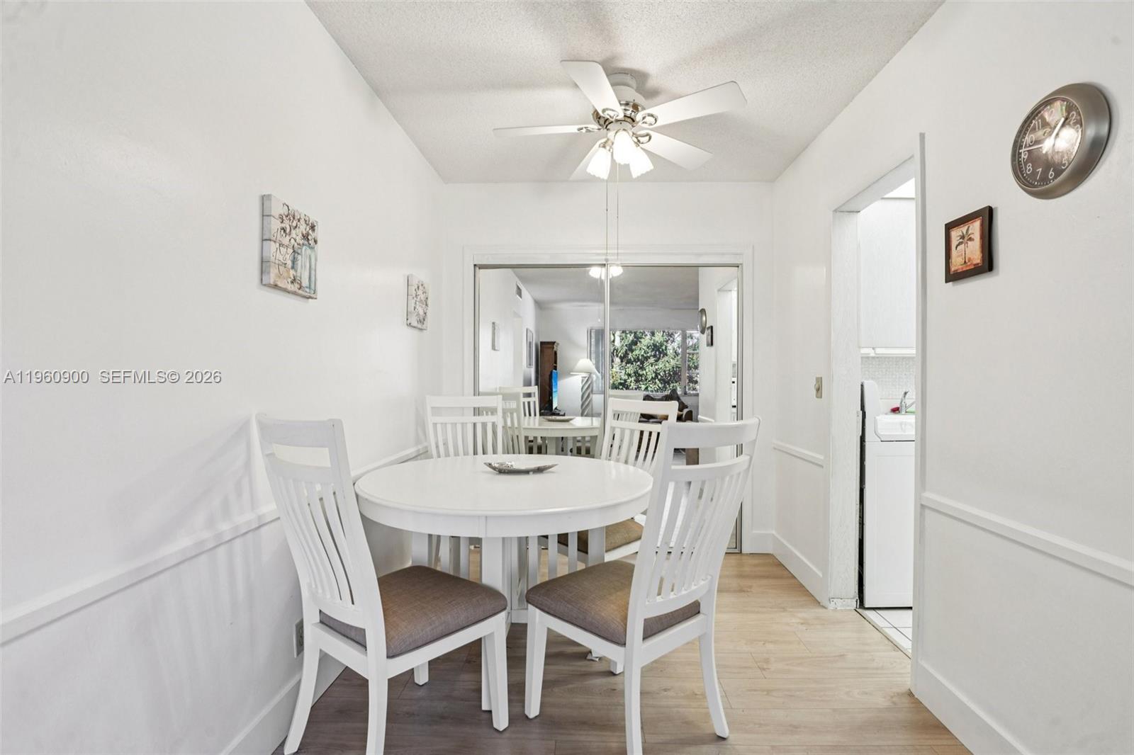 310 South Cypress Road, Unit 730 Pompano Beach, FL 33060 - Photo 10 of 26 a view of a dining room with furniture and wooden floor