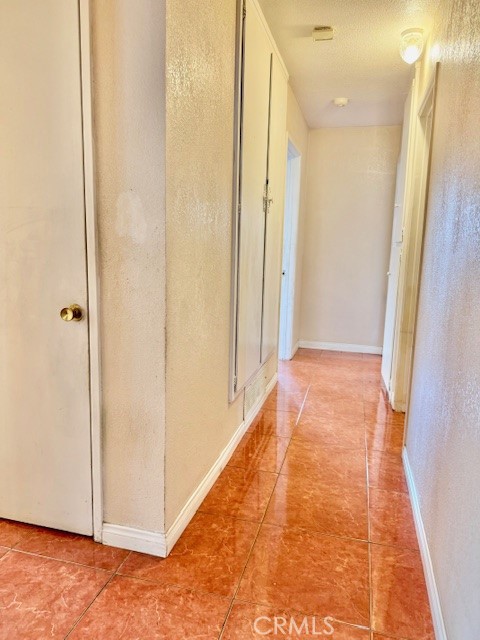 14129 Ragus Street La Puente, CA 91746 - Photo 27 of 33 Central Hallway with 3 Separate Storage Spaces!