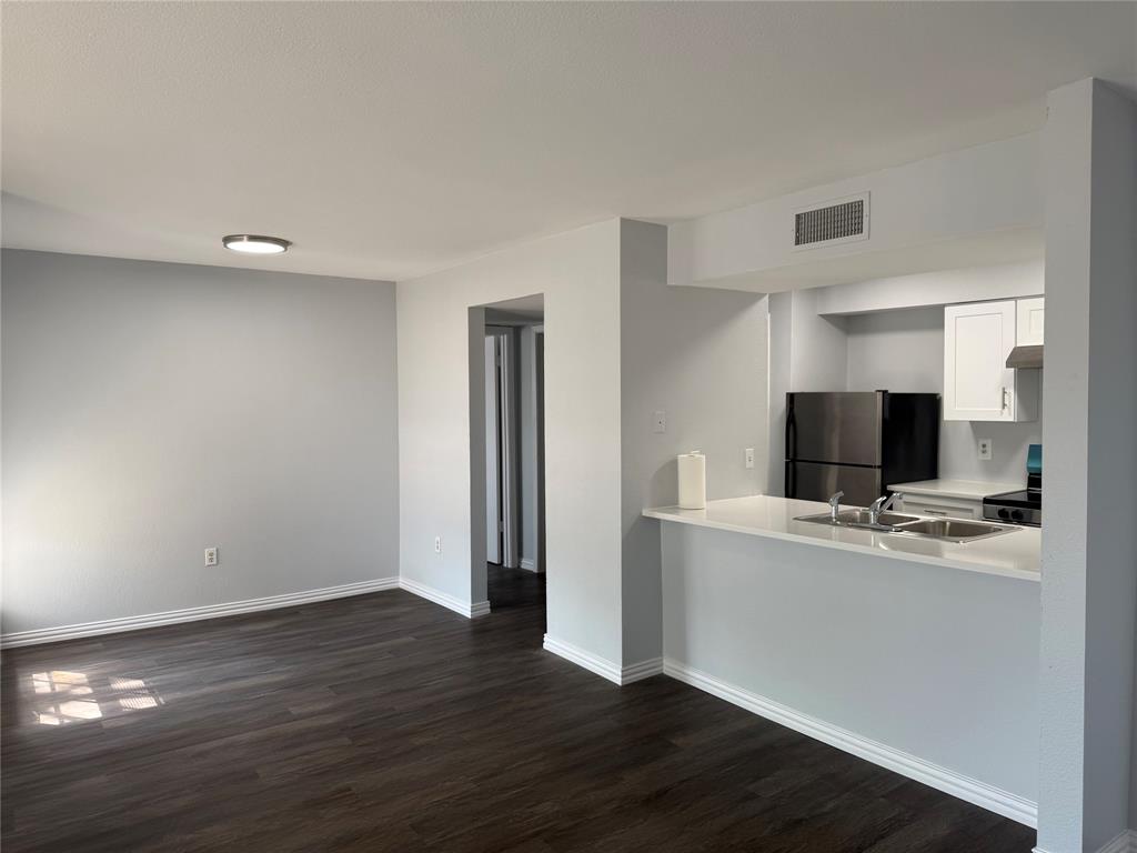 12482 Abrams Road Dallas, TX 75243 - Photo 3 of 4 a view of kitchen with wooden floor