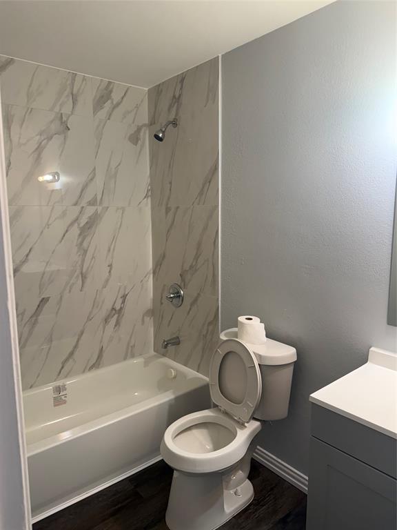 12482 Abrams Road Dallas, TX 75243 - Photo 4 of 4 a bathroom with a toilet sink and shower