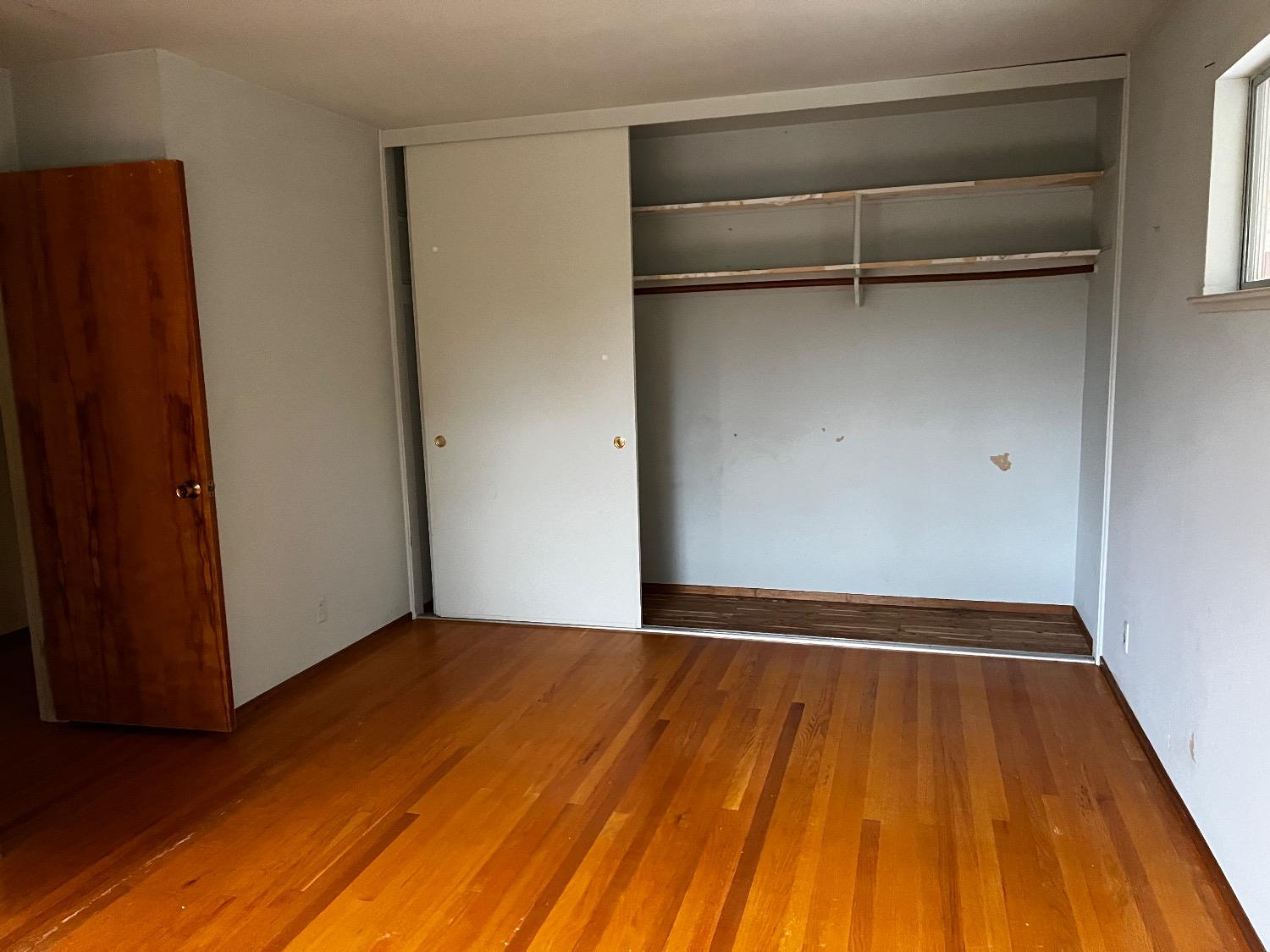 3194 Surmont Drive Lafayette, CA 94549 - Photo 18 of 40 a view of an empty room with wooden floor and a window