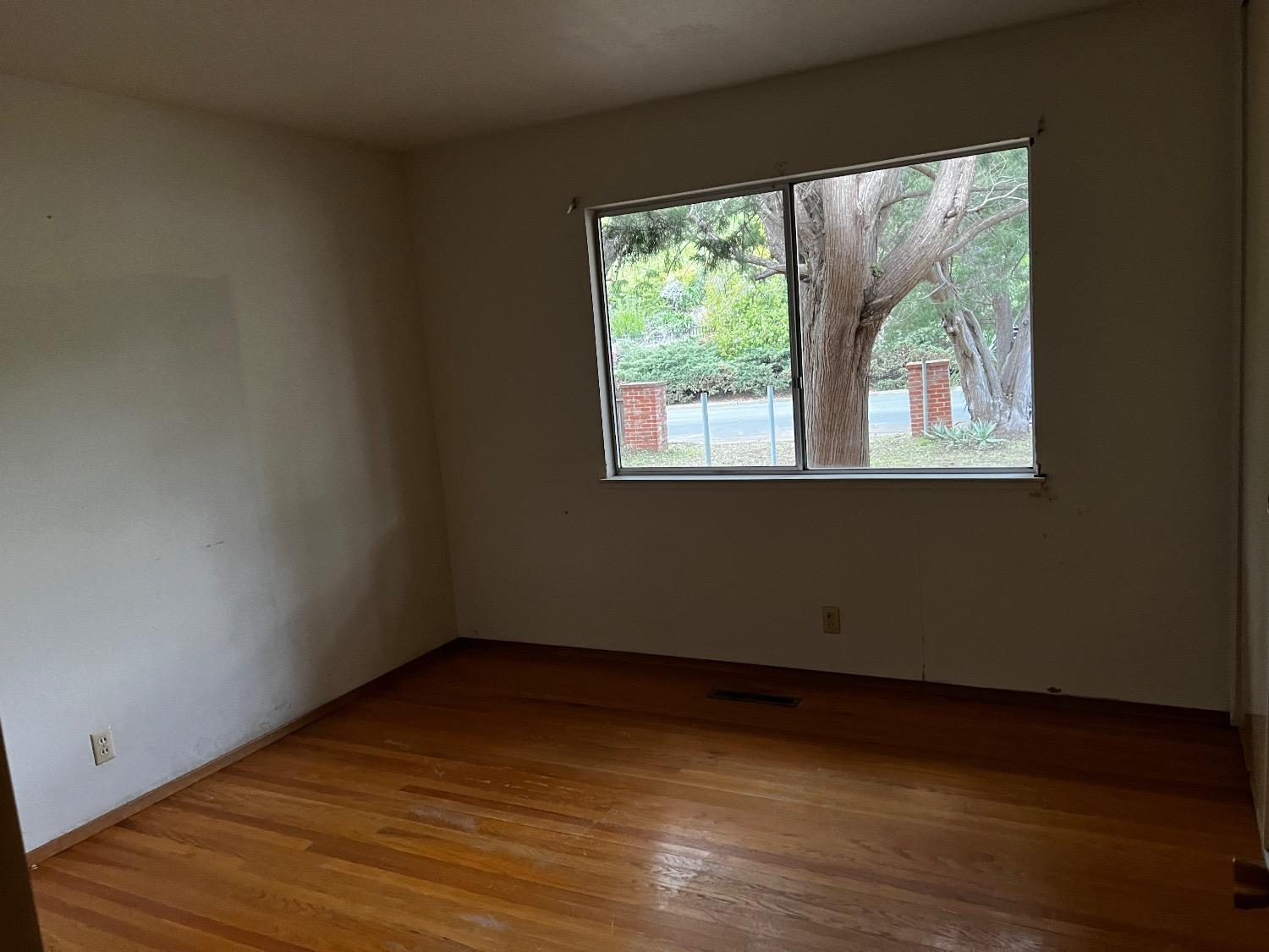 3194 Surmont Drive Lafayette, CA 94549 - Photo 19 of 40 an empty room with wooden floor and windows