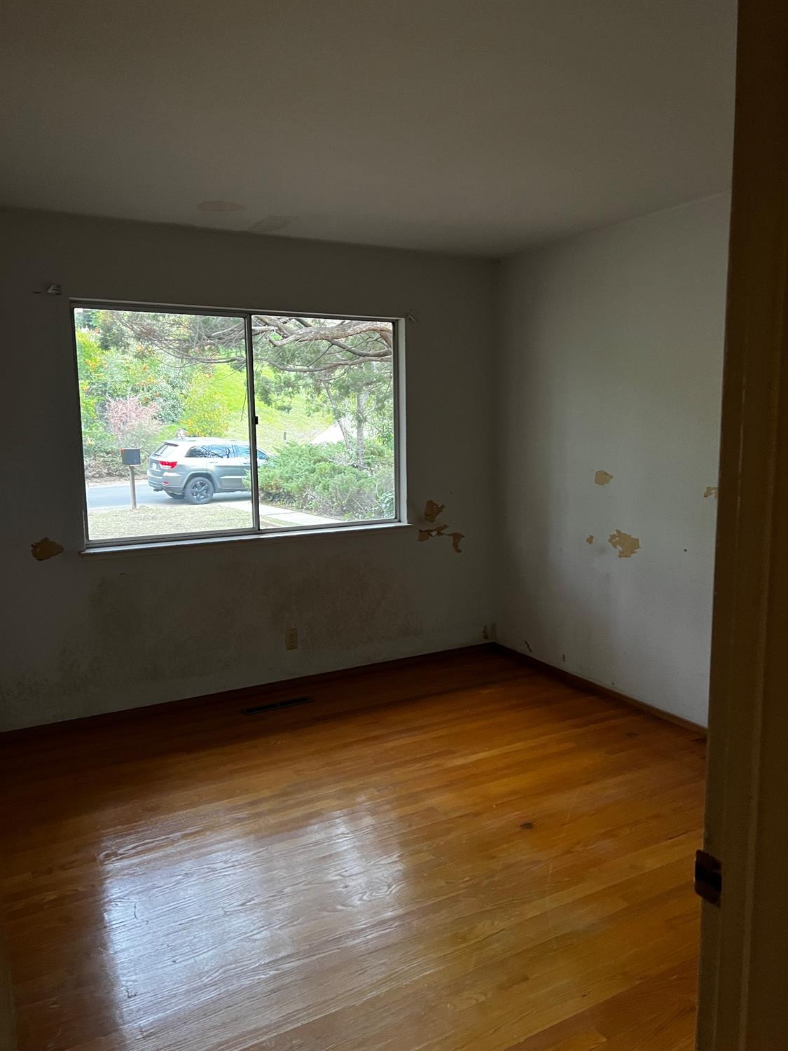 3194 Surmont Drive Lafayette, CA 94549 - Photo 20 of 40 a view of an empty room with wooden floor and a window