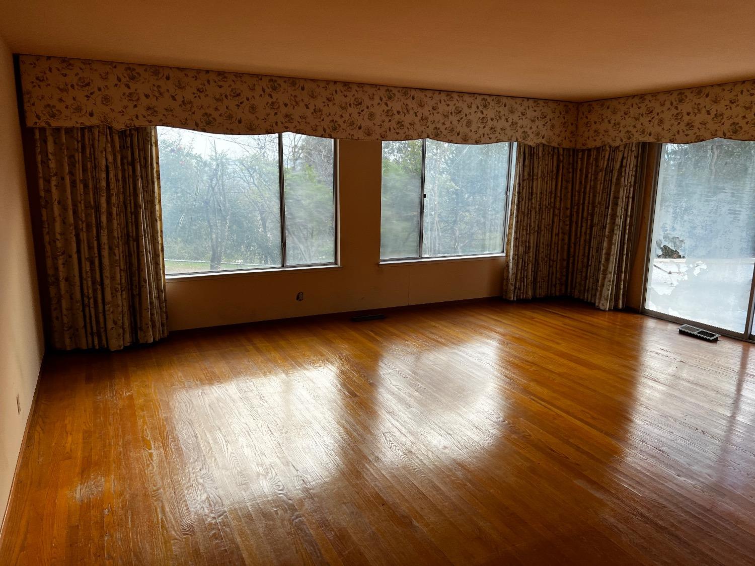 3194 Surmont Drive Lafayette, CA 94549 - Photo 27 of 40 an empty room with wooden floor and windows